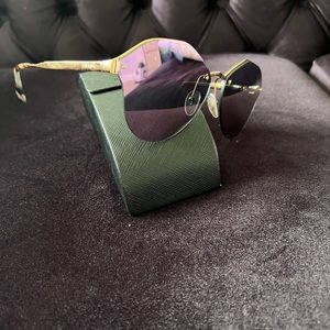 Prada women sunglasses.  Weared one time ONLY